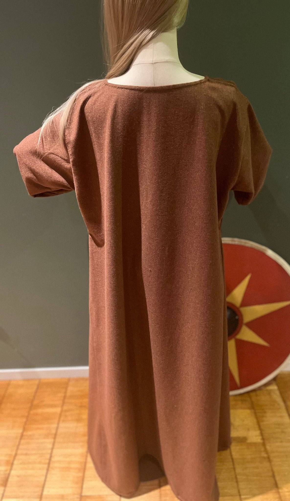 Back view of TYRA Viking woolen dress on mannequin